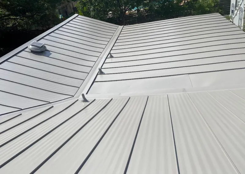 Solar attic fan installed on a metal roof for Roof Ventilation in Archbald